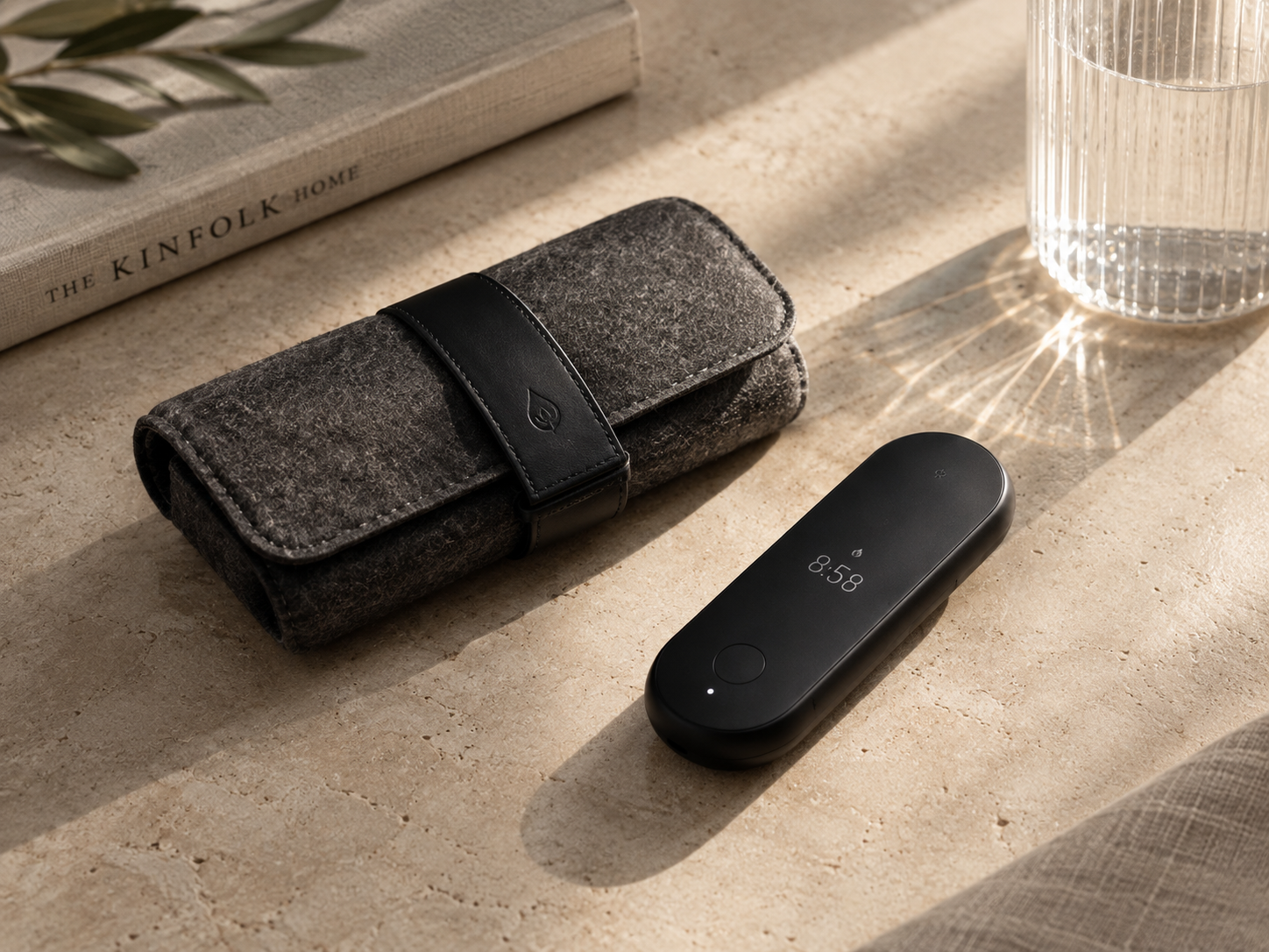 Lumen tracker beside its premium felt travel case, ready for travel